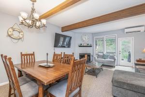 a dining room with a wooden table and chairs at Villages of Wisp 08 Winding Way in McHenry