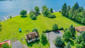 an aerial view of a large grassy island with a house at Villages of Wisp 08 Winding Way in McHenry