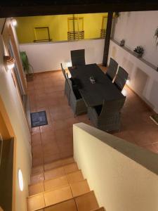 a dining room with a table and chairs at Gomeira Terrace in Cabanas de Tavira