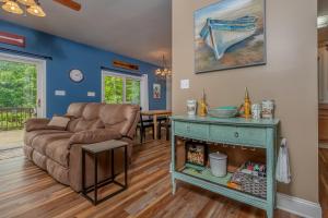 a living room with a couch and a table at Carmel Sunday in Swanton