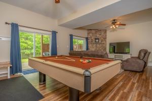 a living room with a pool table in it at Carmel Sunday in Swanton