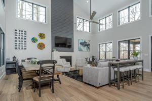 a living room with a couch and a table and chairs at No Black Tie Affair in McHenry