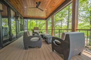 a screened porch with chairs and tables and windows at No Black Tie Affair in McHenry +68 photos