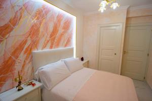 Un pat sau paturi într-o cameră la Adriana's Home