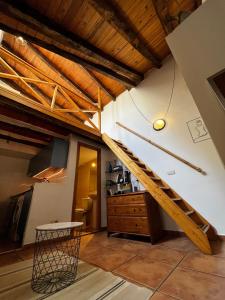 a staircase in a room with wooden ceilings at Latina in Madrid