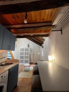 a kitchen with a table and a counter top at Latina in Madrid
