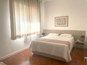 Cama ou camas em um quarto em Grande Hotel Amparo mais 29 fotos