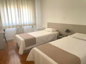 Cama ou camas em um quarto em Grande Hotel Amparo