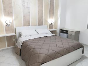 a bedroom with a large bed in a room at B&B Pompeii Luxury in Pompei