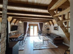 a living room with a couch and a table at Mountain House "Nikki" in Motički Gaj