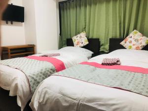 Postel nebo postele na pokoji v ubytování GreenHotel