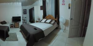 Letto o letti in una camera di Tocumen Sweet Home