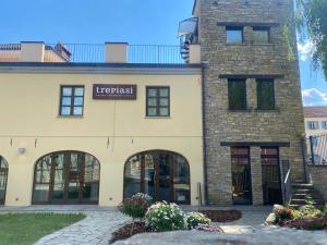 a large brick building with a sign on it at Trepiasì in Cortemilia