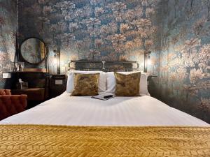 מיטה או מיטות בחדר ב-The Devonshire Villa