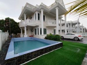 a house with a swimming pool in front of it at RoofTop Villa in Malacca