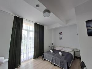 Postel nebo postele na pokoji v ubytování Figaro Apartaments