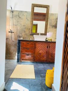 a bathroom with a sink and a mirror at RIAD GALIYA in Marrakech