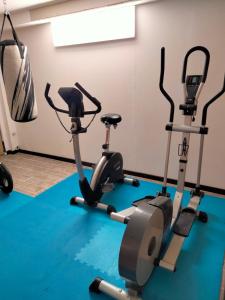 a gym with two exercise bikes in a room at Ferienwohnung CoCo in Haltern