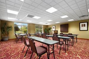 a conference room with tables and chairs in it at Wingate by Wyndham - Chattanooga in Chattanooga