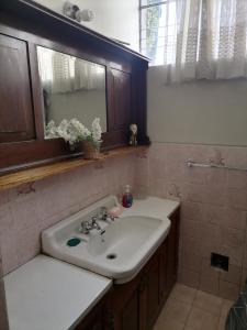 a bathroom with a sink and a mirror at Apartamento Parra in Arequipa