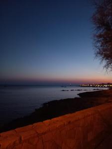 a view of the ocean at night at Maison Chèrie in Parabita