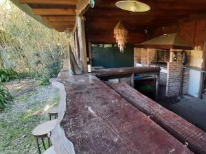 a large wooden table with chairs in a house at Flor de Lis apartmento, Room 1, Room 2 in Mar del Plata