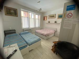 Łóżko lub łóżka w pokoju w obiekcie Appartamento House Apartment Tabe Centro Bologna