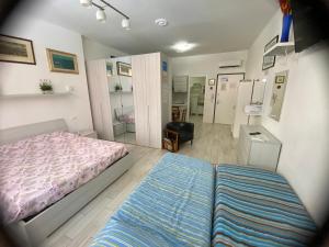 Łóżko lub łóżka w pokoju w obiekcie Appartamento House Apartment Tabe Centro Bologna