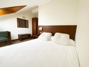 Posteľ alebo postele v izbe v ubytovaní Hotel EntreRobles