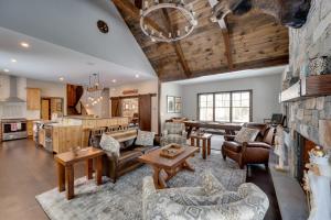 a living room filled with furniture and a stone wall at The Fox House Luxe Lincoln Home with Hot Tub in Lincoln