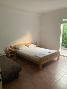 Postel nebo postele na pokoji v ubytování Anita Guest House