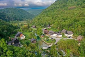an aerial view of a village in the mountains at Guest House Martin in Korana