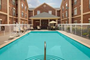 a large swimming pool in front of a building at Homewood Suites Nashville/Brentwood in Brentwood