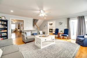 a living room with a couch and a table at Elegant Tybee Island Townhome, Steps to Beach in Tybee Island