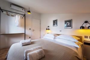 a bedroom with a large bed with two towels on it at The Park Apartment in Zadar