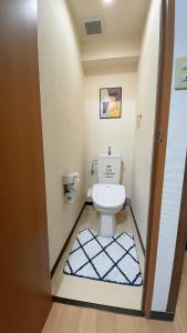 a bathroom with a toilet in a room at Takamatsu-205 in Takamatsu