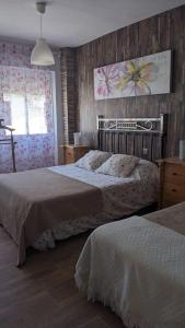 Cama o camas de una habitación en Apartamento Turístico Monteceli
