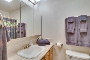 a bathroom with a sink and a mirror at Wintergreen Home with Hot Tub, Deck and Mountain Views in Wintergreen +29 photos