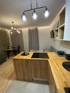 a kitchen with a counter with a sink in it at Love Glow Studio in Krakow
