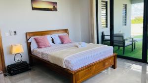 Postel nebo postele na pokoji v ubytování Blissful Villa
