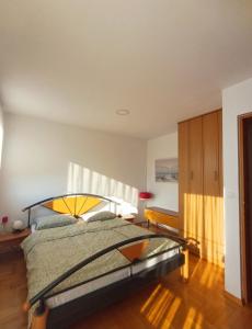 a bedroom with a large bed in a room at Apartma AJDA in Velenje