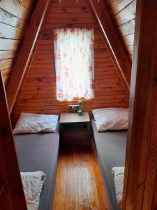 Postel nebo postele na pokoji v ubytování Domek letniskowy "U Zośki"