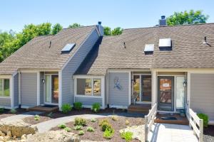 a home with a roof at Galena Townhome with Community Perks! in Galena