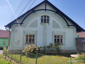 a white house with a black roof at Chalupa Čížkovská desítka 