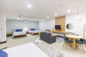 Postel nebo postele na pokoji v ubytování Paradise Bay Hotel Boutique