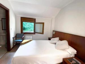 Posteľ alebo postele v izbe v ubytovaní Hotel EntreRobles