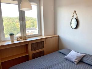 Łóżko lub łóżka w pokoju w obiekcie Kierunek Sopot CENTRUM