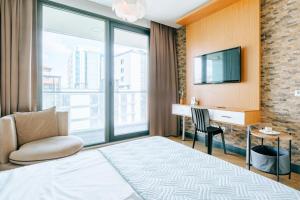 מיטה או מיטות בחדר ב-Cozy Studio Flat w Balcony 10 min to Marmara Forum