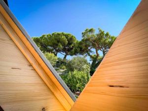 a view from the outside of a house with a surfboard at Starsbox con piscina e idromassaggio in Celle Ligure