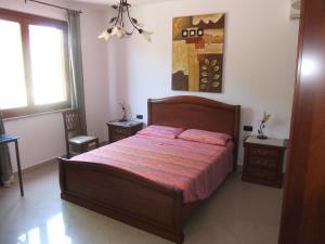 Postel nebo postele na pokoji v ubytování B&B La Pineta